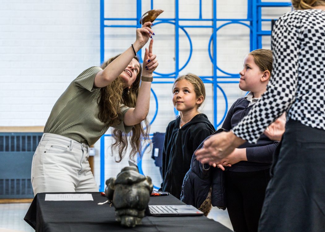 curator shares information about Innuit goggles with pupils