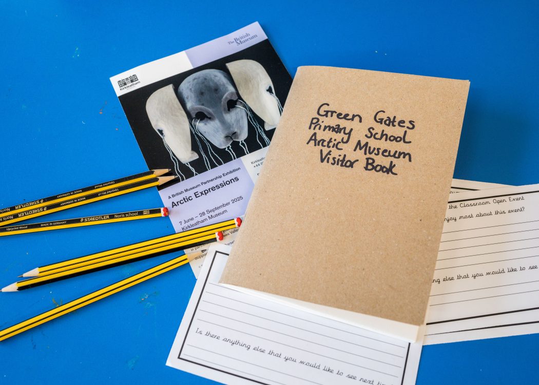 A closed visitors book,some pencils and some flyers for the Arctic Expressions exhibition