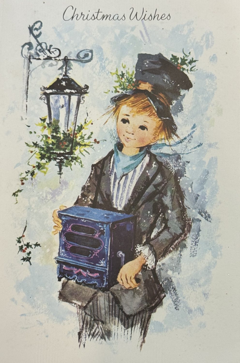 A child holding a musical box. Part of a Christmas card from the Museum of Hartlepool's collection.