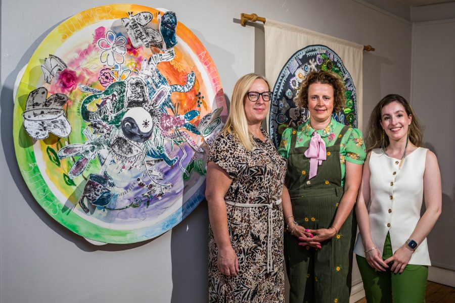 Teachers and British museum staff standing in front of the childrens artwork at Kirkleatham Museum as part of the Arctic Expressions exhibition